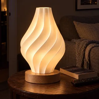 Lit spiral lamp beside a sofa in a dark living room
